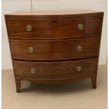 A bow fronted chest of drawers, three long drawers and brass ring handles (H98cm W102cm D48cm)