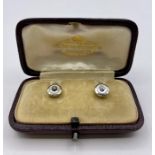 A cased set of 18 ct gold and diamond shirt studs.