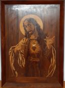 A representation of 'The sacred heart of Jesus' on inlay wood, (93x26 cm).
