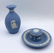 Three items of Wedgwood Jasperware, small vase, pin dish and pill box.