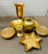 Eight gold coloured items for the home.