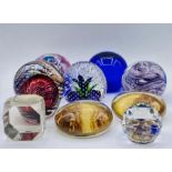 A selection of nine assorted glass paperweights