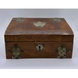 A wooden jewellery box with white metal decoration and cartouche