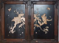 A pair of Japanese Shibayama plaques depicting eagles about to hunt carved with inlays of faux ivory