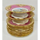 Twelve hand painted tea plates and two cake stands in pink and gilt porcelain