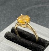 A 14ct gold ring with citrine central stone (1.8g) (Size J)