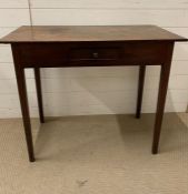 A mahogany side table on tapering legs (H77cm W90cm D46cm)