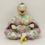 A Meissen marked porcelain nodding pagoda figure, marked with blue crossed swords, model number