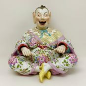 A Meissen marked porcelain nodding pagoda figure, marked with blue crossed swords, model number