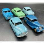 A selection of five unboxed vintage Dinky diecast cars