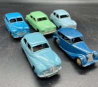 A selection of five unboxed vintage Dinky diecast cars