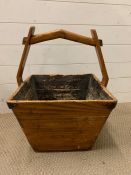 A wooden rice bucket