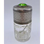 A White metal and glass scent bottle with hinged lid and inset green stone.AF (H10cm)