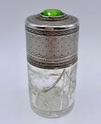 A White metal and glass scent bottle with hinged lid and inset green stone.AF (H10cm)