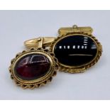 Two 9ct gold and semi precious stone Gents cuff links (9.1g Total weight)