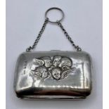 A silver Ladies purse with angel design embossed by C E Williams, hallmarked Birmingham 1905 (8cm