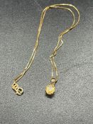 A 9ct gold chain with citrine pendant (1.7g)