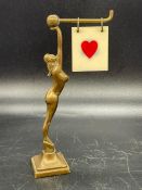 An Art Deco figure of a woman Trumps and Suit Marker for Bridge etc.