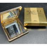 A Gucci pocket mirror, in original box