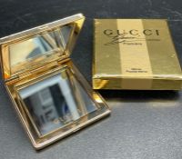 A Gucci pocket mirror, in original box