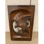 Folk art oak wall plaque carved to centre of an eagle (51cm x 32cm)