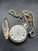 A Thomas Russel & sons silver pocket watch for Thavies Inn London and Albert chain and winder.