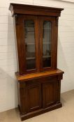 A Victorian mahogany bookcase with two panel glazed doors and two arch panelled doors to cupboard