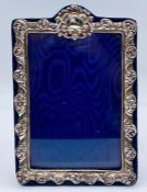 A silver picture frame, blue velvet easel back, 18.5 cm x 12 cm