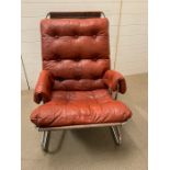 A Mid Century chrome tubular frame chair with leather button back seat