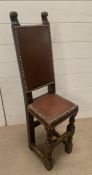 A late Victorian oak and leather correction chair (H92cm W25cm D25cm)