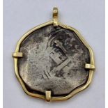 An Antique coin in 14ct gold mount.