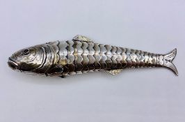 An articulated silver fish with hinged head and semi precious stone ideas, probably Russian. (21.5cm