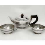 An Elkington & Co Art Deco silver tea set hallmarked for 1919, with teapot, sugar bowl and milk