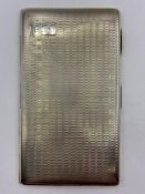 A 1929 silver cigarette case, JC Ltd, hallmarked Birmingham (Total weight 218g)