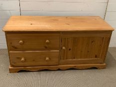 A pine TV unit with drawers (H57cm W122cm D49cm)