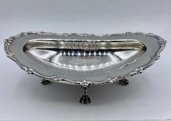 A silver bowl on four claw feet by James Dixon & Sons Ltd, hallmarked for Sheffield 1903, marked