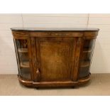 A French style figured walnut credenza, gilt work, bowed glass cabinets, breakfront with central