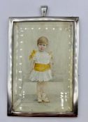 A silver framed miniature of a small child hallmarked for London 1897