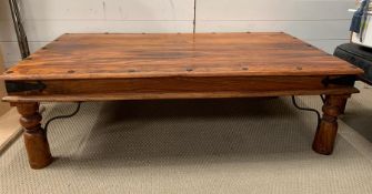 A hardwood coffee table (H42cm W75cm D136cm)