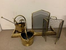 A selection of brass fire screens and tools