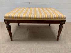 An 19th century Empire style mahogany and gilt metal mounted stool (H40cm W75cm D50cm)