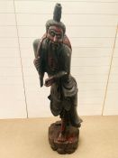 A wooden carved oriental statue (153cm/5ft)