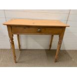 A pine console table with drawers to centre (H73cm W90cm D42cm)