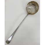 A George Smith (III) shell ladle, hallmarked for London 1777 (35 cm Long)