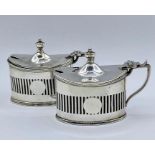 A pair of silver salts with blue glass liners by Haseler Brothers (Edward John Haseler & Noble