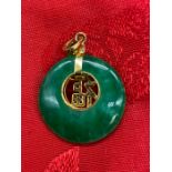An 18ct gold and Jade pendant