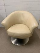 A contemporary leather tub chair on chrome swirl base