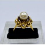 An 18ct gold, pearl and ruby ring (6.8g) Total weight, one missing stone.