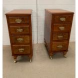 A pair of burr walnut side cabinets on castors