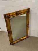 A gilt frame wall mirror (57cm x 86cm)